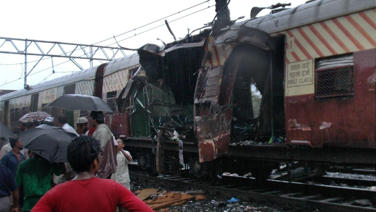 In this July 11, 2006 file photo, a train coach is damaged by a bomb blast at Matunga railway station in Mumbai. (PTI Photo)