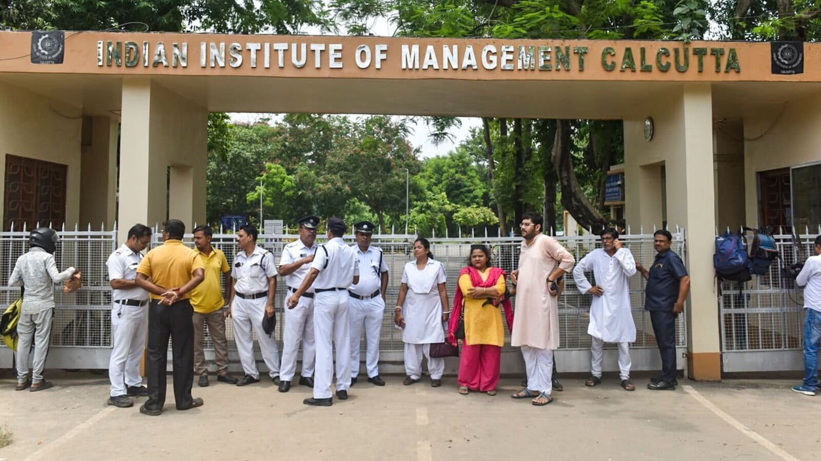 Police personnel deployed outside IIM Calcutta after a student was allegedly raped inside the boys' hostel of the institute, in Kolkata, on Saturday, July 12, 2025.