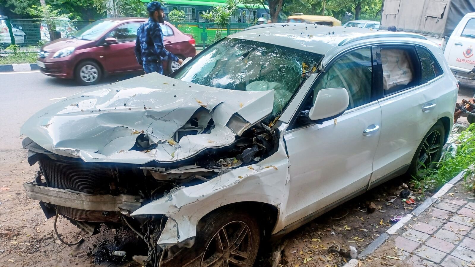 A view of the damaged vehicle, which allegedly ran over five sleeping pavement dwellers on the footpath near the Indian Oil Petrol Pump,  (ANI Photo/Amit Sharma)