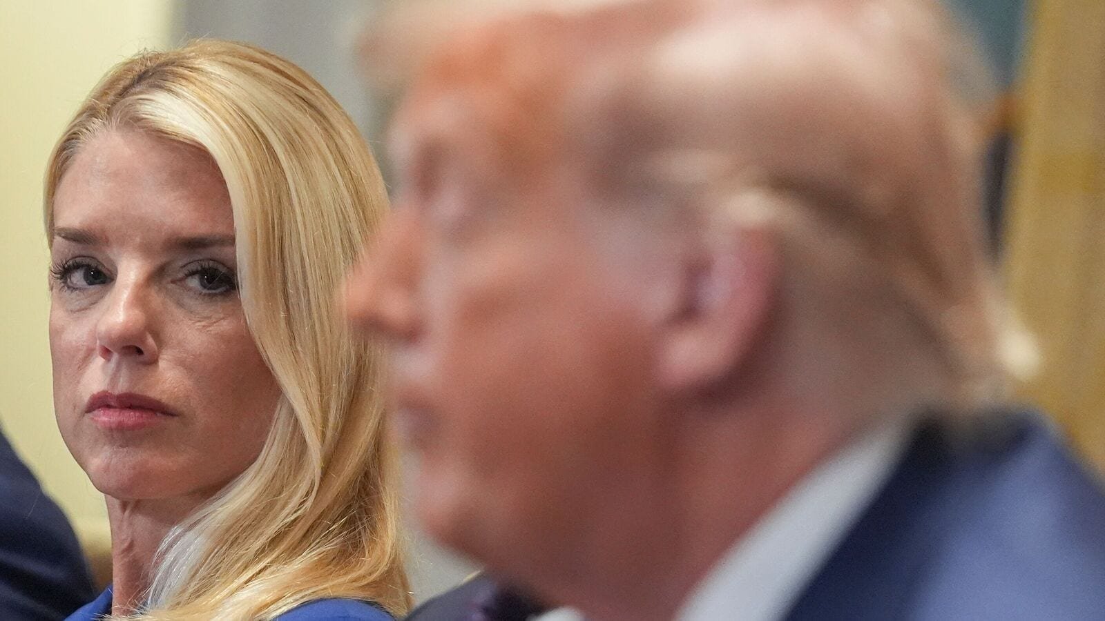 President Donald Trump, far right, speaking during a cabinet meeting with Secretary of Housing, Eric Scott Turner, left, and Attorney General Pam Bondi, center, at the White House, Tuesday, July 8, 2025, in Washington. (AP Photo/Evan Vucci)