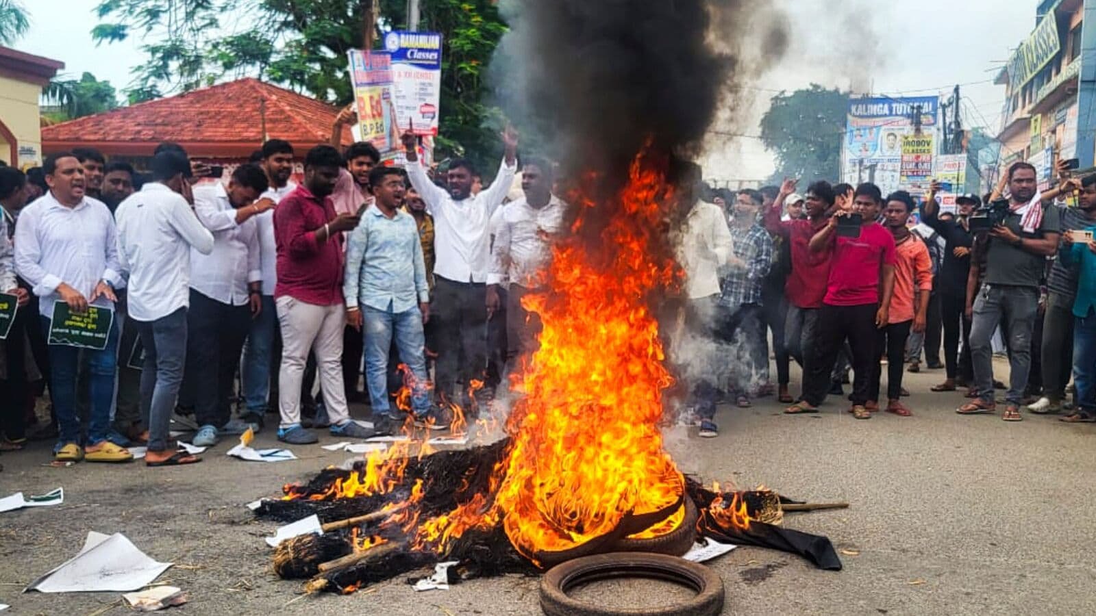 Members of Biju Chhatra Janata Dal stage a protest over self-immolation bid by Fakir Mohan College student in Balasore on Monday.