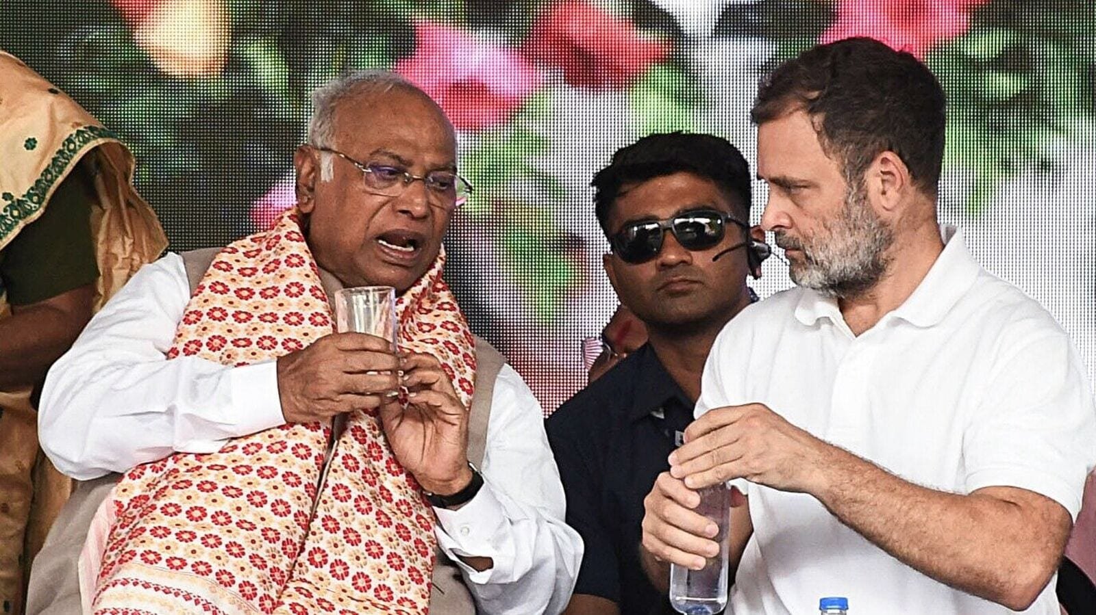 Congress President Mallikarjun Kharge and Lok Sabha LoP and party MP Rahul Gandhi in conversation during the Congress Workers' meeting, at Chaygaon in Kamrup on Wednesday.