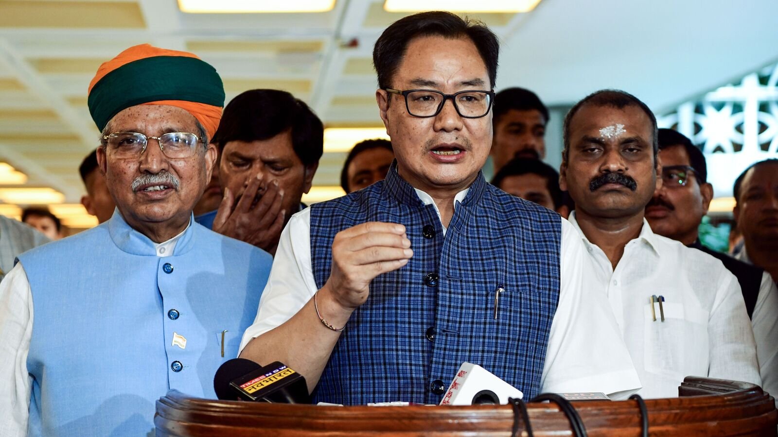 Union Ministers and BJP MPs Kiren Rijiju (centre), Arjun Ram Meghwal, L Murgan speak to the media during the all-party meeting ahead of the Monsoon session of Parliament that begins on July 21, at Parliament House Annexe in New Delhi on Sunday.