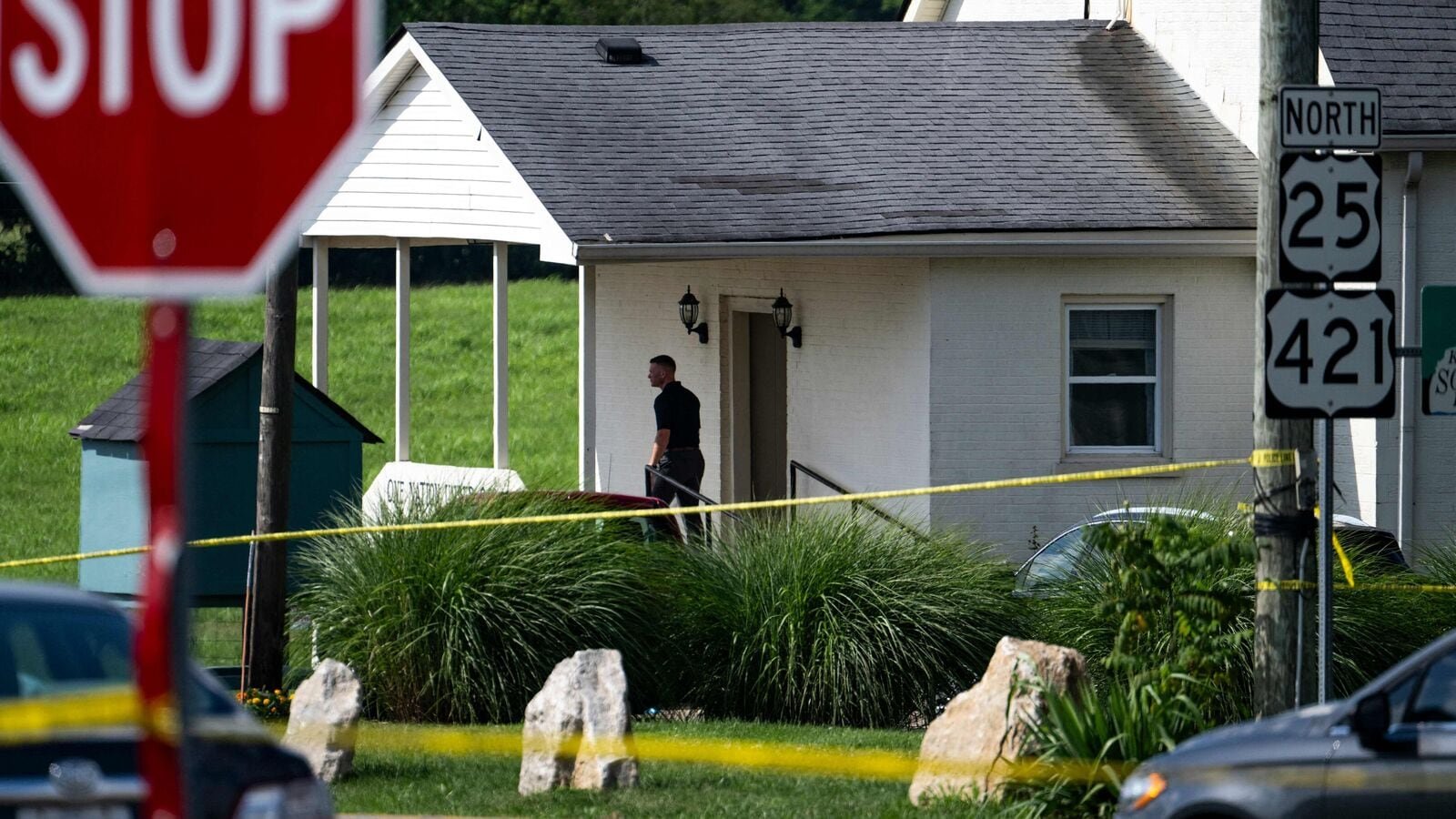 Police assess the scene after a shooting at Richmond Road Baptist Church on July 13, 2025 in Lexington, Kentucky. Two people were killed and two others injured at the church