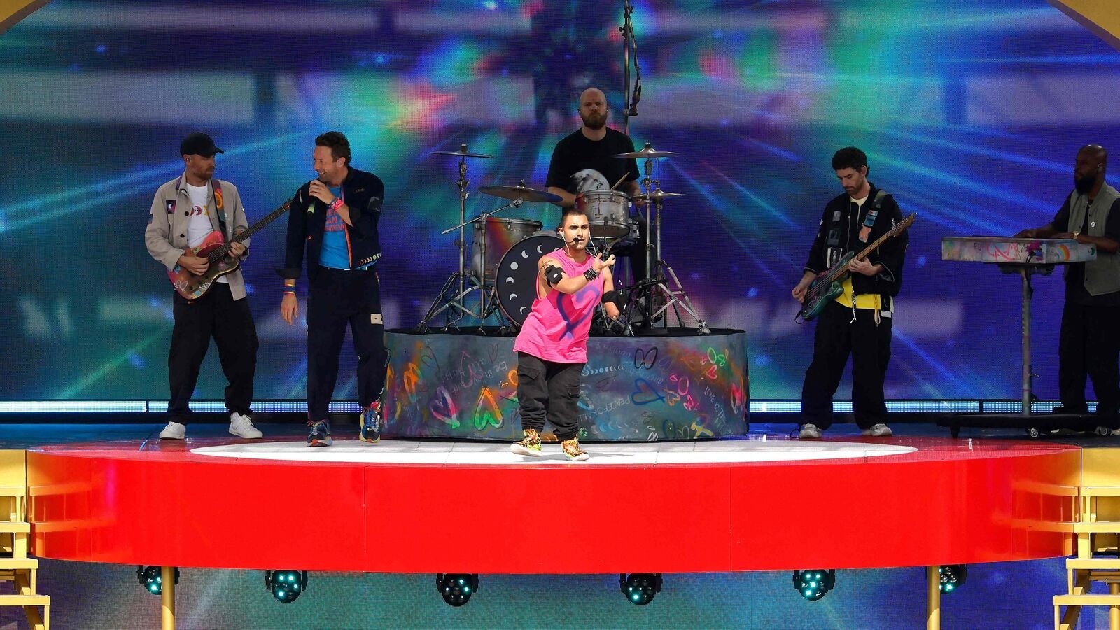 Chris Martin of Coldplay and Emmanuel Kelly perform during the halftime show during the FIFA Club World Cup 2025 Final match between Chelsea FC and Paris Saint-Germain at MetLife Stadium on July 13, 2025 in East Rutherford, New Jersey.