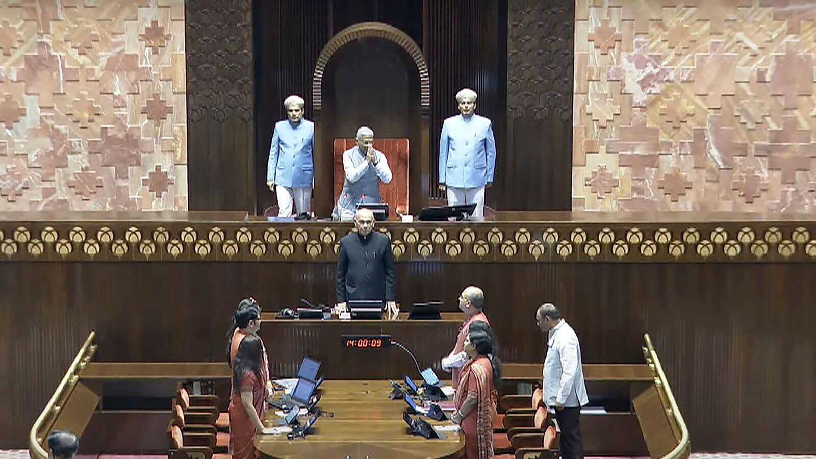 New Delhi: Rajya Sabha Deputy Chairman Harivansh Narayan Singh greets members of the House during the Monsoon session of Parliament, in New Delhi, Tuesday, July 22, 2025. (Sansad TV via PTI Photo)