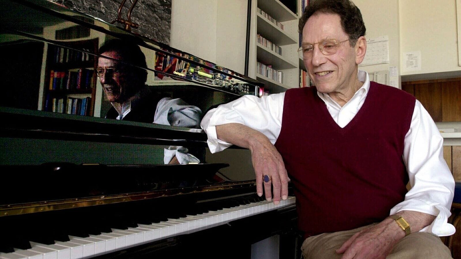 Musician Tom Lehrer sits beside the piano in his house in Santa Cruz, Calif., on April 21, 2000. (AP Photo)