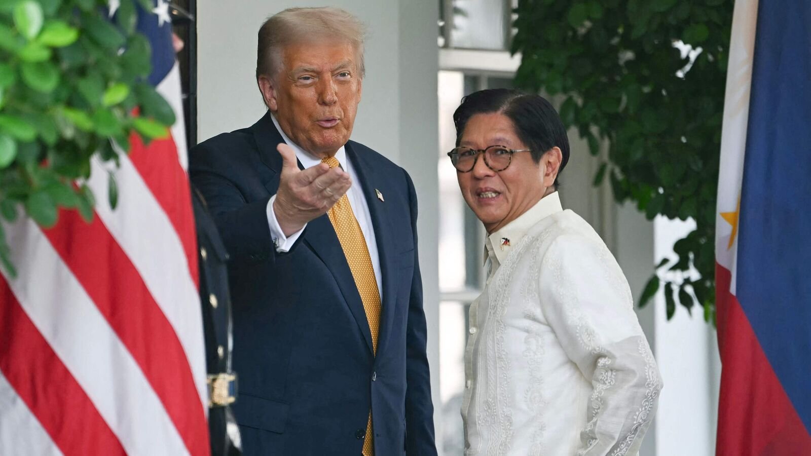 US President Donald Trump welcomes Filipino President Ferdinand Marcos Jr. at the entrance to the West Wing of the White House in Washington, DC on July 22, 2025. (Photo by ANDREW CABALLERO-REYNOLDS / AFP)