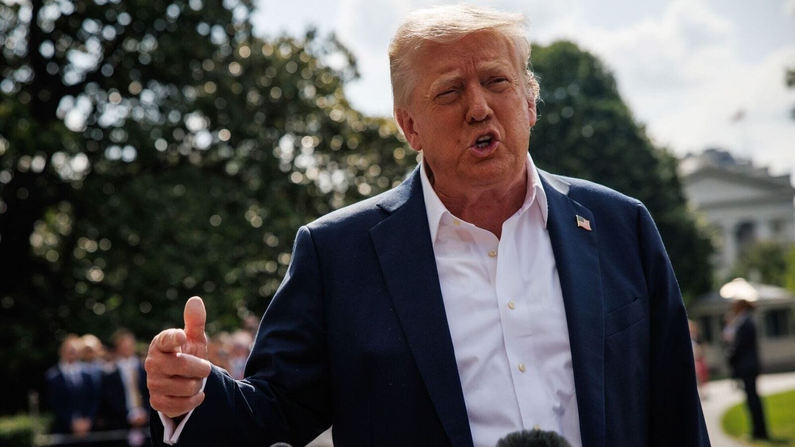 US President Donald Trump speaks to members of the media on the South Lawn of the White House before boarding Marine One in Washington, DC, US, on Friday, July 11, 2025.