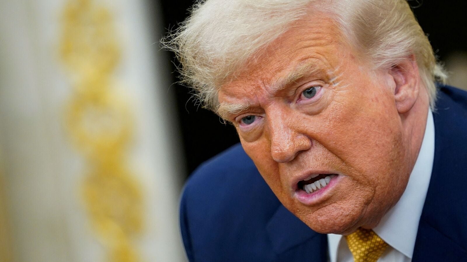 FILE PHOTO: U.S. President Donald Trump speaks, as he meets with Bahrain's Crown Prince and Prime Minister Salman bin Hamad Al Khalifa (not pictured), in the Oval Office at the White House in Washington, D.C., U.S., July 16, 2025. REUTERS/Nathan Howard/File Photo