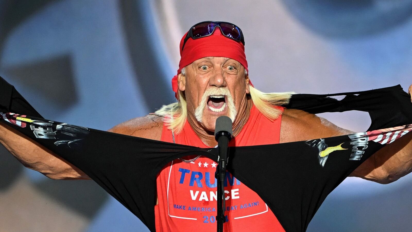 US pro-wrestler Hulk Hogan rips his shirt off to reveal a Trump-Vance campaign shirt during the last day of the 2024 Republican National Convention at the Fiserv Forum in Milwaukee, Wisconsin, on July 18, 2024. (Photo by ANDREW CABALLERO-REYNOLDS / AFP)
