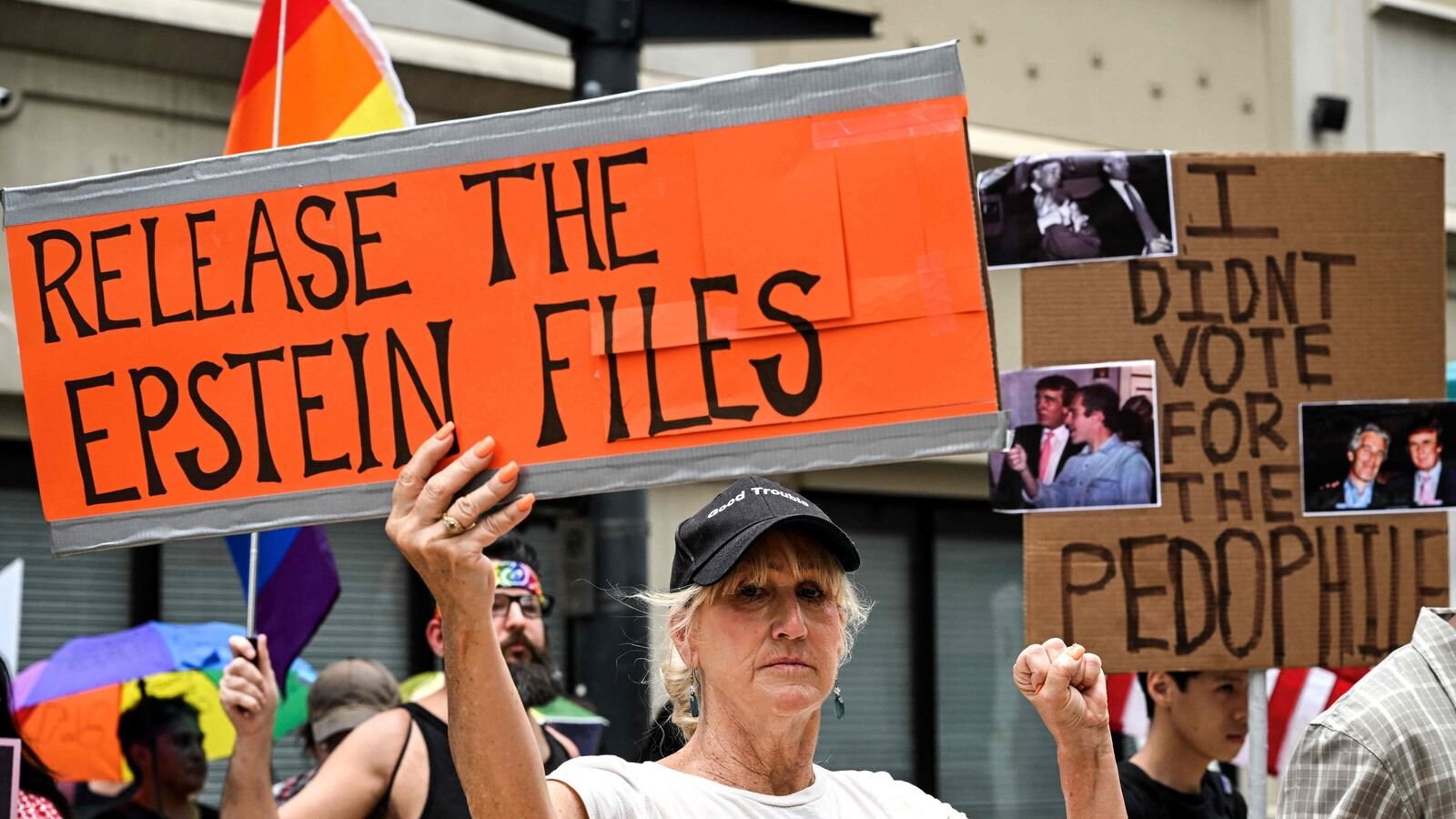 People holds signs calling for the release of files regarding late sex offender Jeffrey Epstein participate in a protest as part of the 'Good Trouble Lives On' national day of action against the administration of US President Donald Trump in Houston, Texas, on July 17, 2025. US President Donald Trump blasted his own supporters and 'stupid' Republicans on July 16, 2025, as he went on the attack against anyone questioning his administration's handling of the case of dead sex criminal Jeffrey Epstein. Trump is facing the most serious split in his loyal right-wing base since he returned to power, over claims that his administration is covering up lurid details of disgraced financier Epstein's crimes to protect rich and powerful figures. Epstein died by suicide in a New York prison in 2019 -- during Trump's first term -- after being charged with sex trafficking in a scheme where he allegedly groomed young and underage women for sexual abuse by the rich and powerful. (Photo by RONALDO SCHEMIDT / AFP)