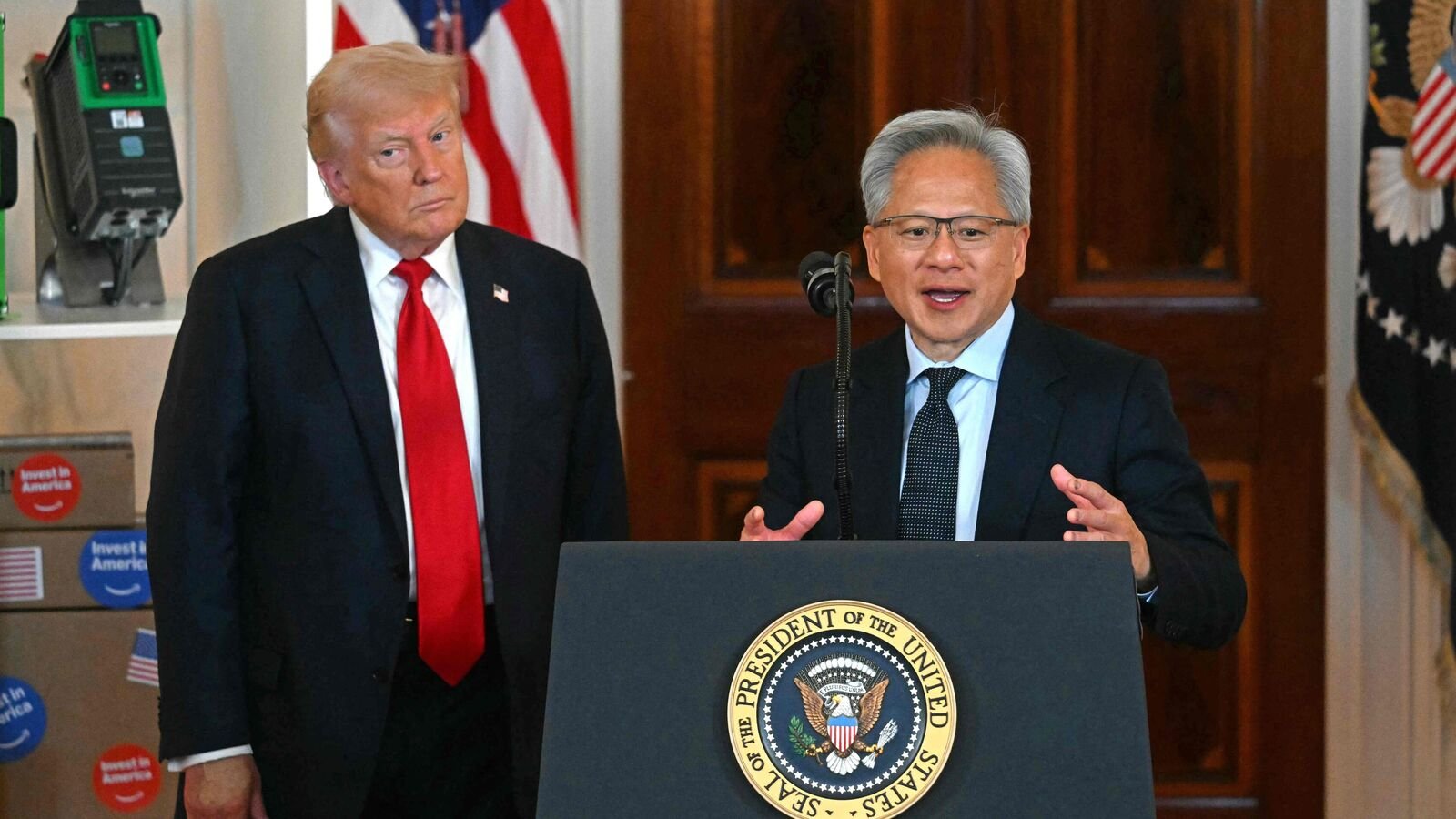 Nvidia CEO Jensen Huang (R) speaks alongside US President Donald Trump