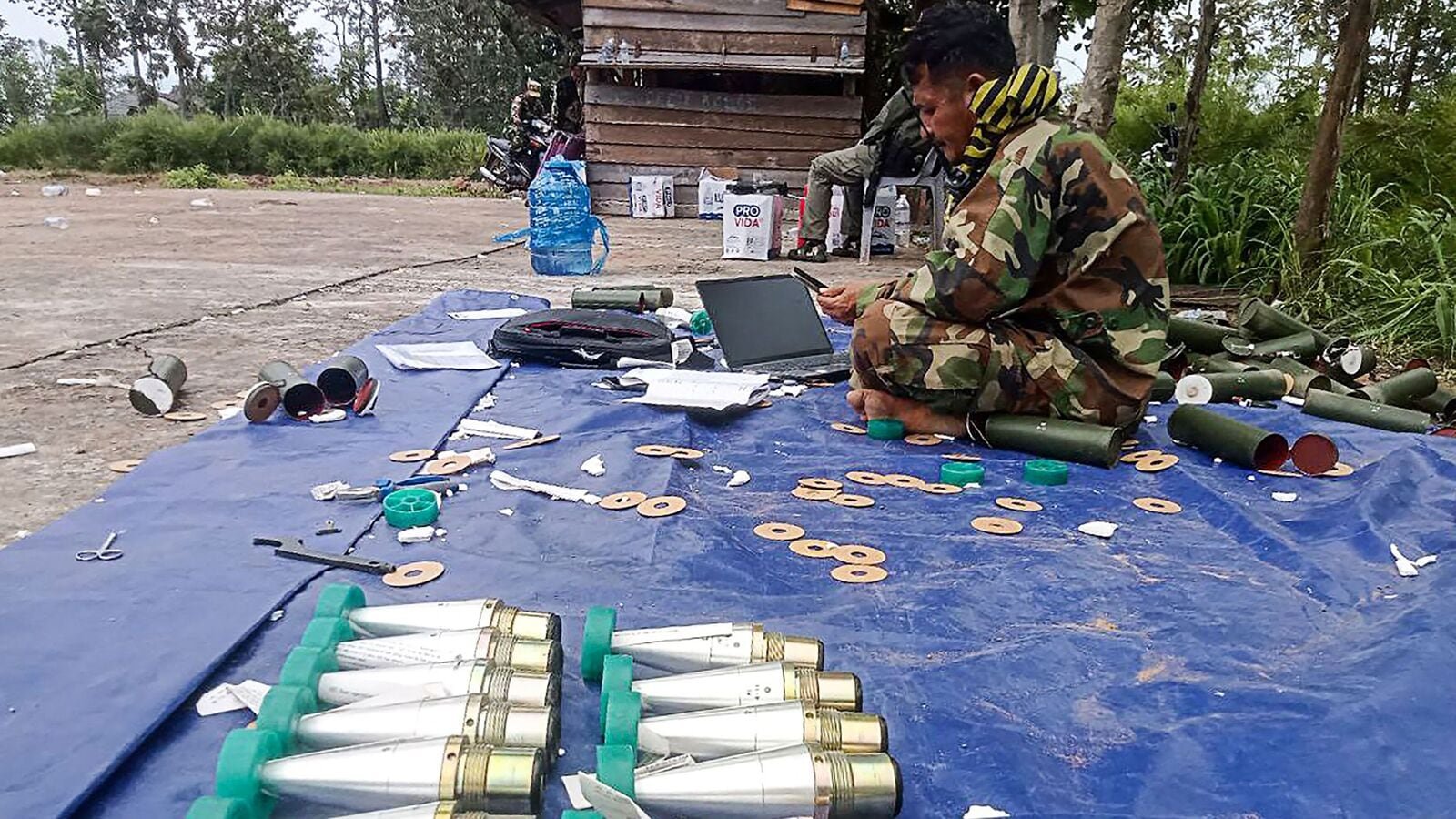 A Cambodian soldier prepares ordnance in Preah Vihear province on July 24, 2025. Thailand launched air strikes on Cambodian military targets on July 24 as Cambodia fired rockets and artillery, killing a civilian, in a dramatic escalation of a long-running border row between the two neighbours.