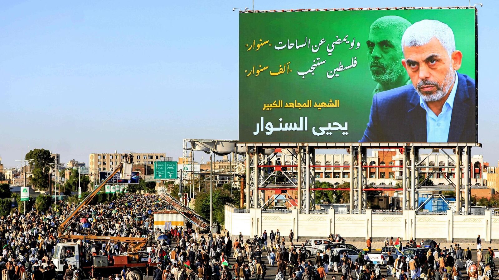 FILE PHOTO: A billboard depicting Hamas' slain leader Yahya Sinwar with the Arabic slogan 'if Sinwar departs from the battlefields, Palestine will birth a thousand Sinwars', during a rally in Yemen's Houthi-controlled capital Sanaa.