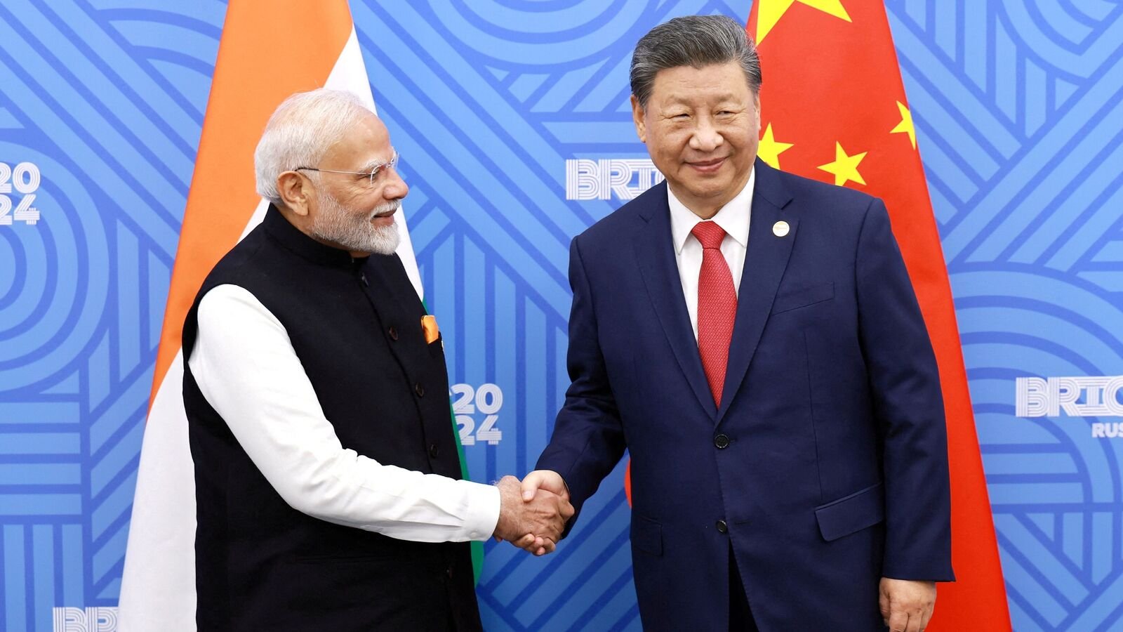 FILE PHOTO: Chinese President Xi Jinping and India Prime Minister Narendra Modi meet on the sidelines of the BRICS summit in Kazan, Russia October 23, 2024.