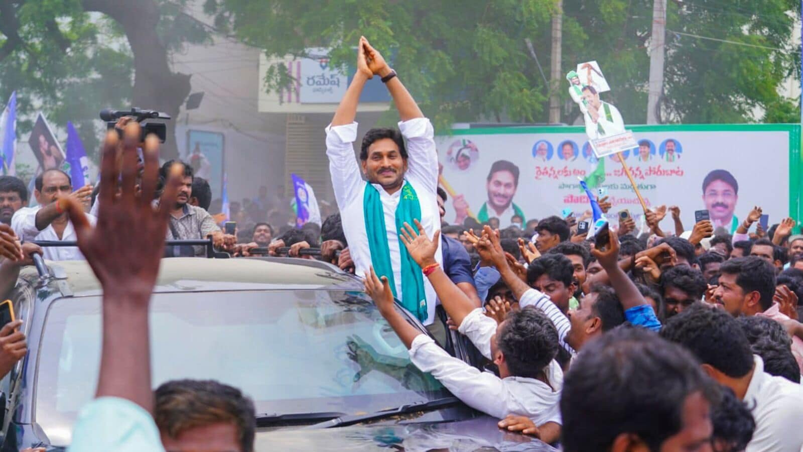 FILE PHOTO: YSR Congress Party President YS Jagan Mohan Reddy greets supporters who gathered during his visit at the Podili Tobacco Board on June 11.