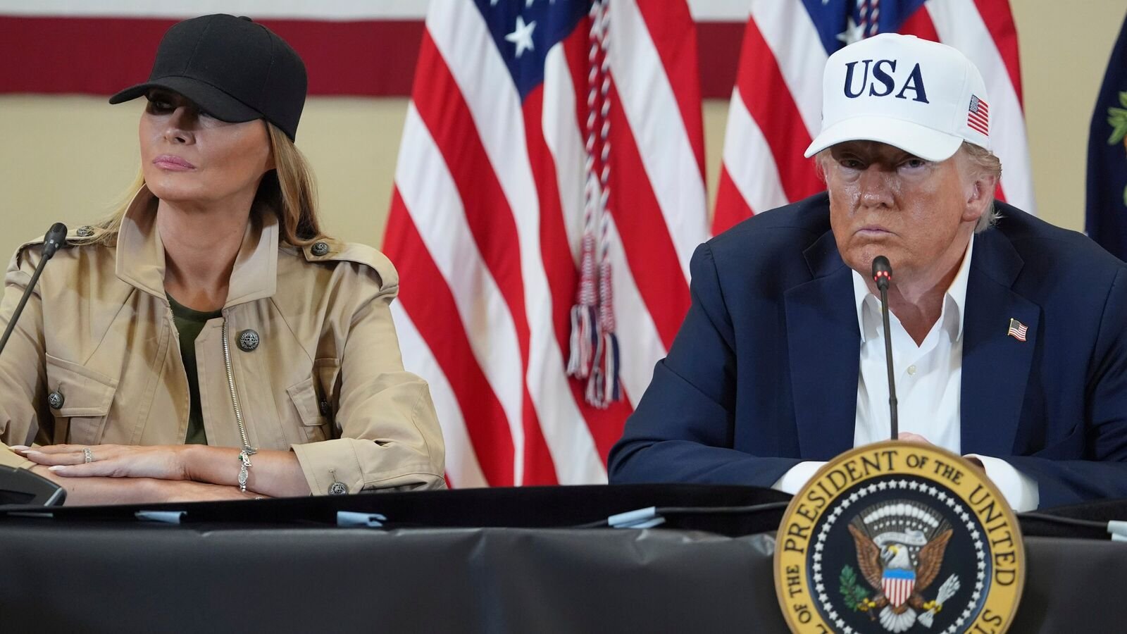 President Donald Trump, right, and first lady Melania Trump listen during a roundtable discussion with first responders and local officials at Hill Country Youth Event Center in Kerrville, Texas, during a tour to observe flood damage, on Friday, July 11, 2025.
