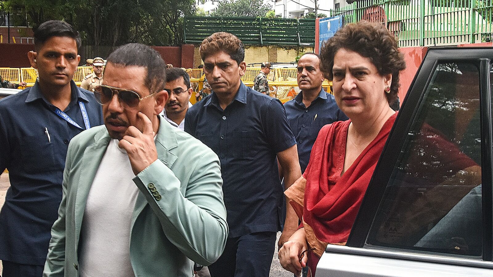 New Delhi: Businessman Robert Vadra, with wife and Congress MP Priyanka Gandhi Vadra, arrives to appear before the Enforcement Directorate (ED) at its office for his questioning in connection with the UK-based arms consultant Sanjay Bhandari linked money laundering case, in New Delhi, Monday, July 14, 2025. (PTI Photo) (PTI07_14_2025_000095A)