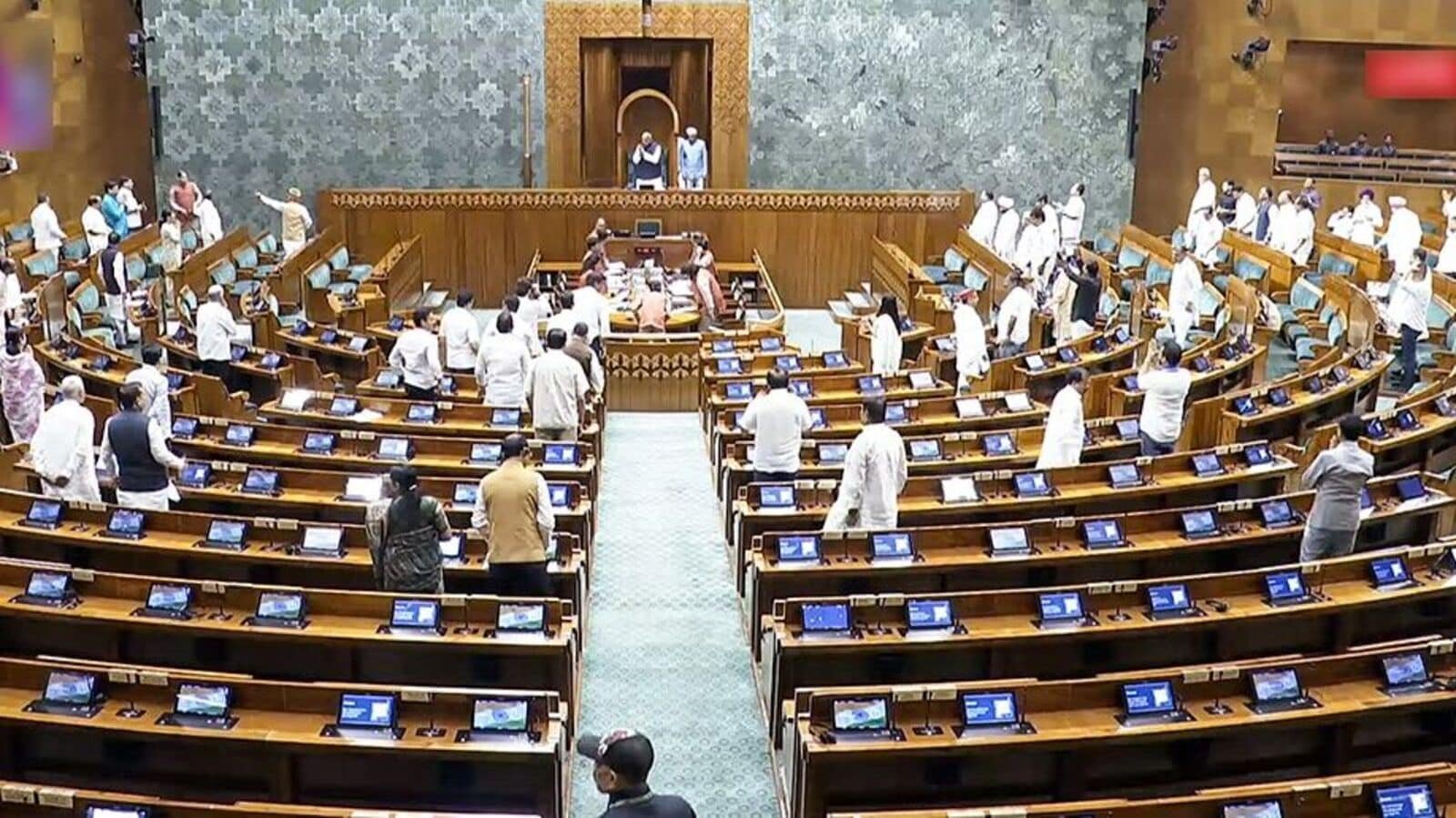 Opposition MPs create ruckus in Lok Sabha during the Monsoon Session of Parliament, in New Delhi on Friday. (Sansad TV/ANI Video Grab)