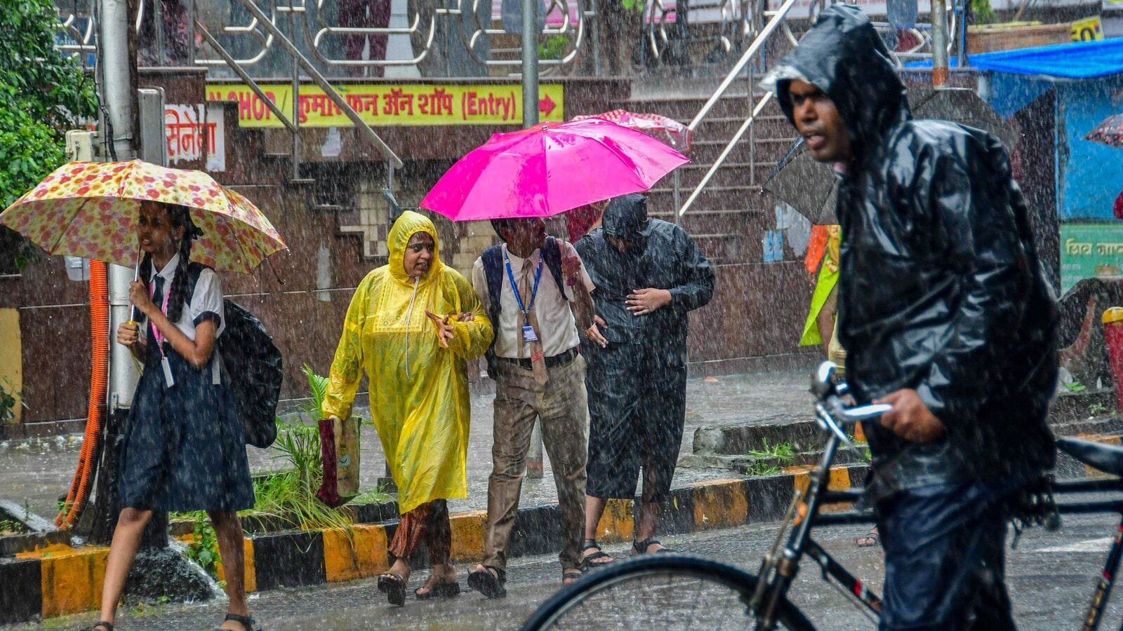 Mumbai: Heavy rain lashes financial capital as commuters shield themselves on July 21.