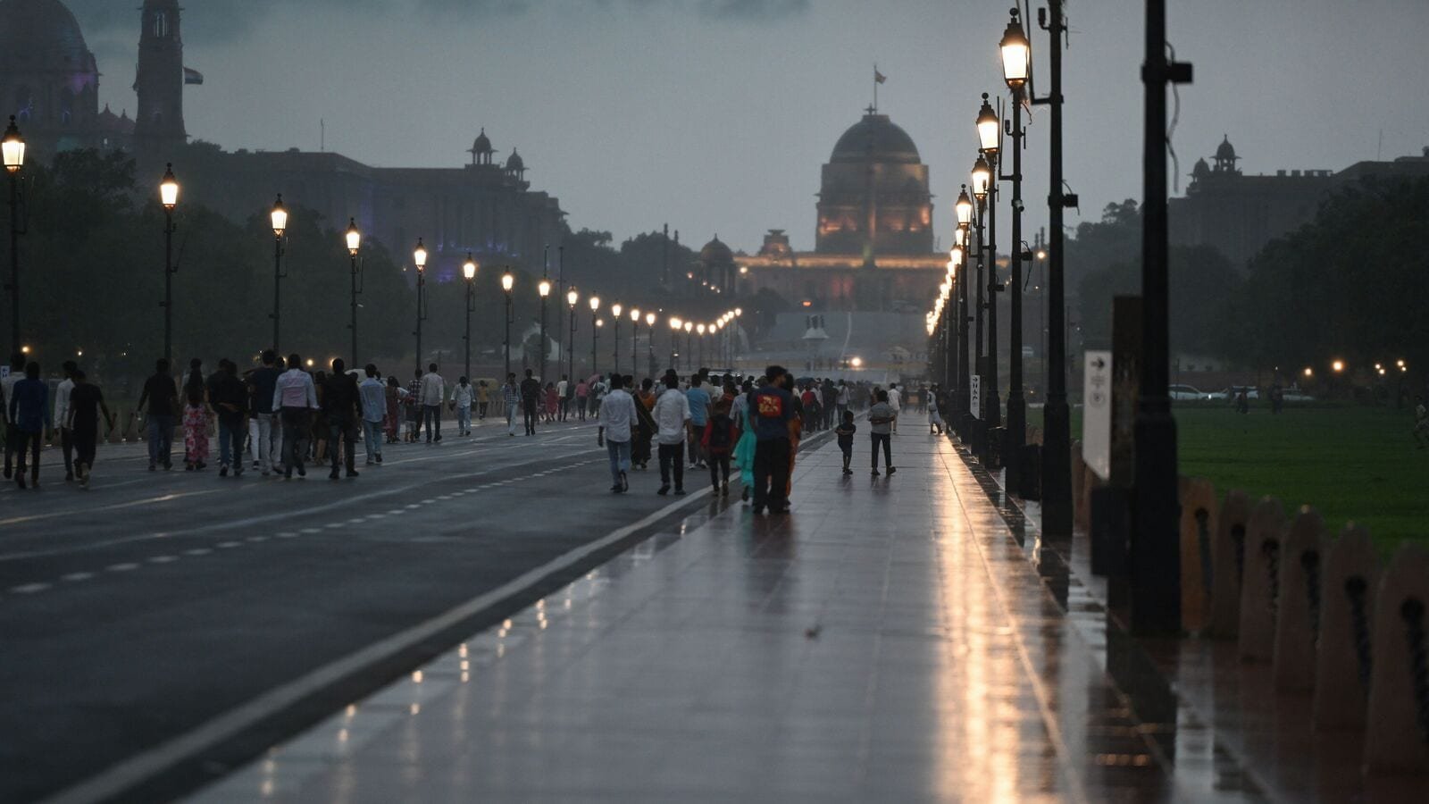 New Delhi, India - July 13, 2025: People enjoy rain at Kartavya Path in New Delhi, India, on Sunday, July 13, 2025.  (Photo by Sanjeev Verma/ Hindustan Times)