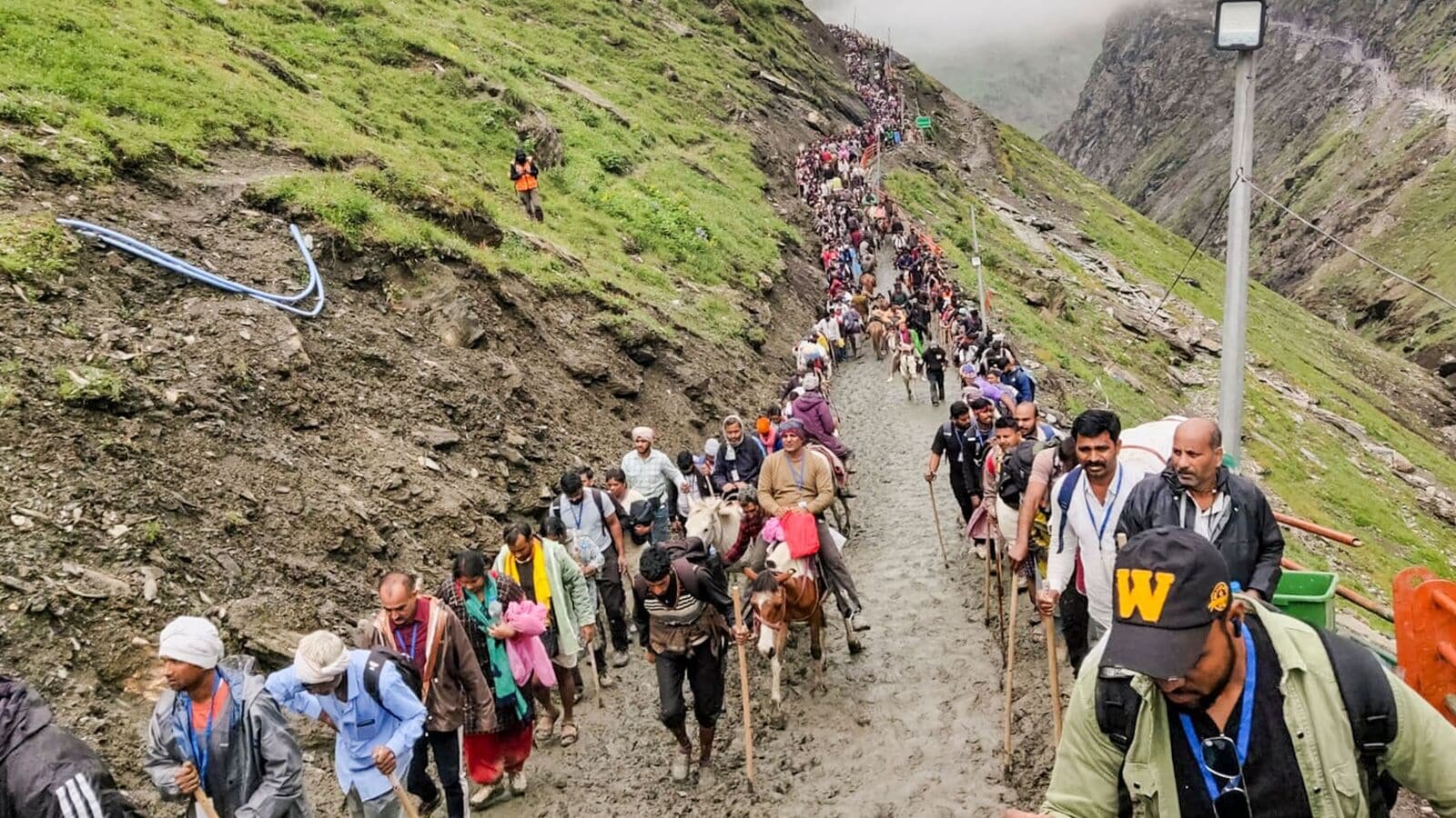 Anantnag: People on the way to Amarnath cave shrine during the annual pilgrimage, at Pahalgam, in Anantnag district, Jammu & Kashmir, Thursday, July 17, 2025. (PTI Photo)(PTI07_17_2025_000054A)