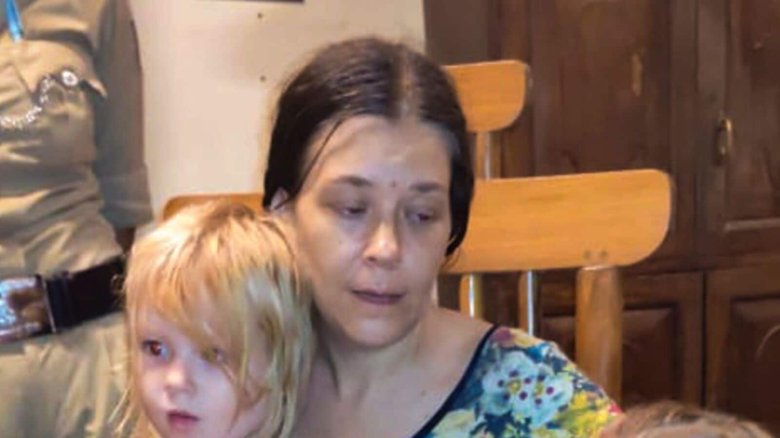 A Russian woman and her two children after they were rescued by security personnel from a remote cave in Ramatirtha hills, in Uttara Kannada district, Karnataka. (PTI Photo)