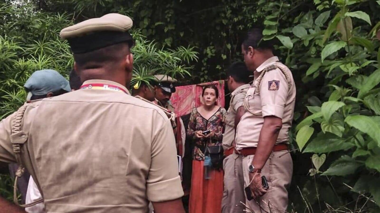 Security personnel rescue a Russian woman and her two children from a remote cave in Ramatirtha hills, in Uttara Kannada district, Karnataka.