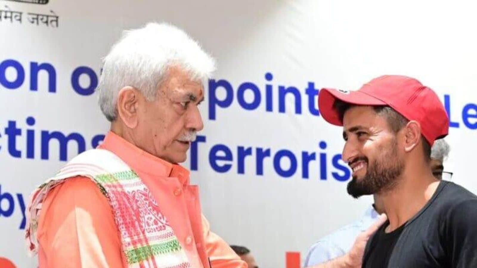 Srinagar, Jul 13 (ANI): Jammu and Kashmir Lieutenant Governor Manoj Sinha hands over a job appointment letter to the Next of Kin of a terror victim, in Srinagar on Sunday. (@OfficeOfLGJandK X/ANI Photo)