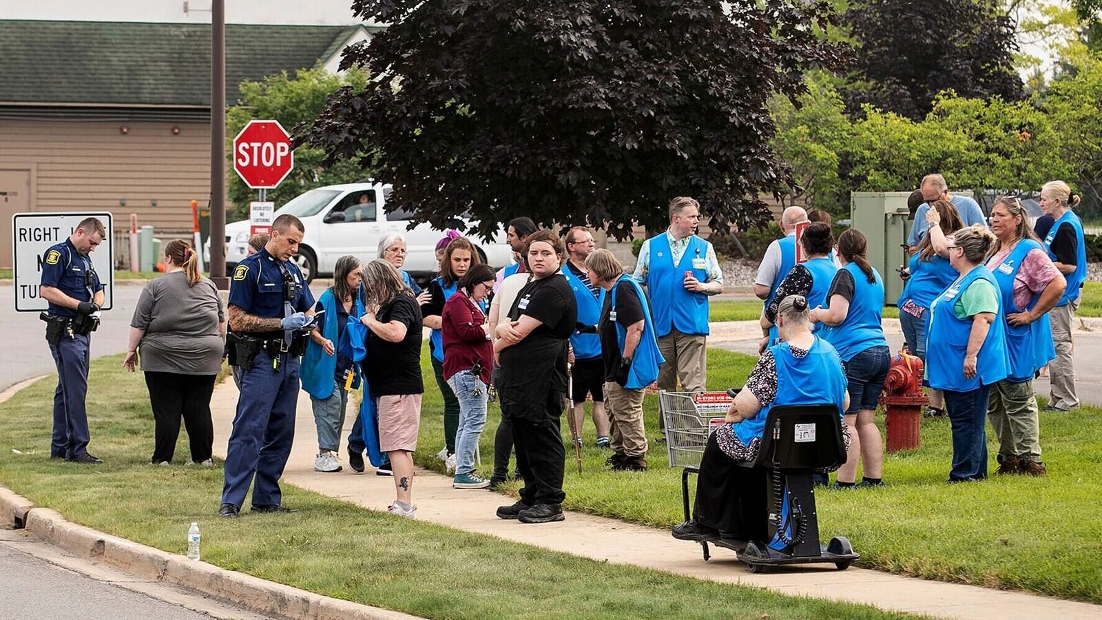 Walmart stabbing case: Michigan State Police officers interrogating employees near the scene after the stabbing incident in Traverse City on July 26.