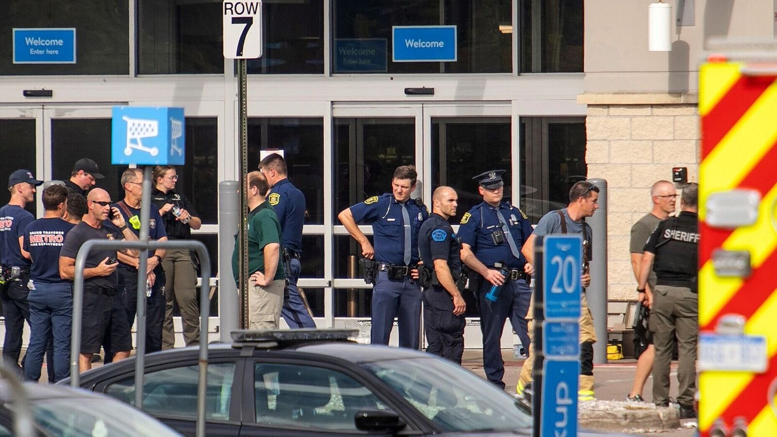 Members of the law enforcement in the area work the scene after a stabbing incident at a Walmart in Traverse City, Mich., Saturday July 26, 2025. (Jan-Michael Stump/Traverse City Record-Eagle via AP)