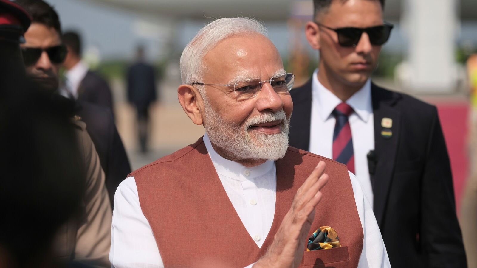 India's Prime Minister H. E. Narendra Modi waves upon arriving at the Kotoka International Airport in Accra, Ghana. Wednesday, July 2, 2025. (AP Photo/Reuben Ekow Quansah)