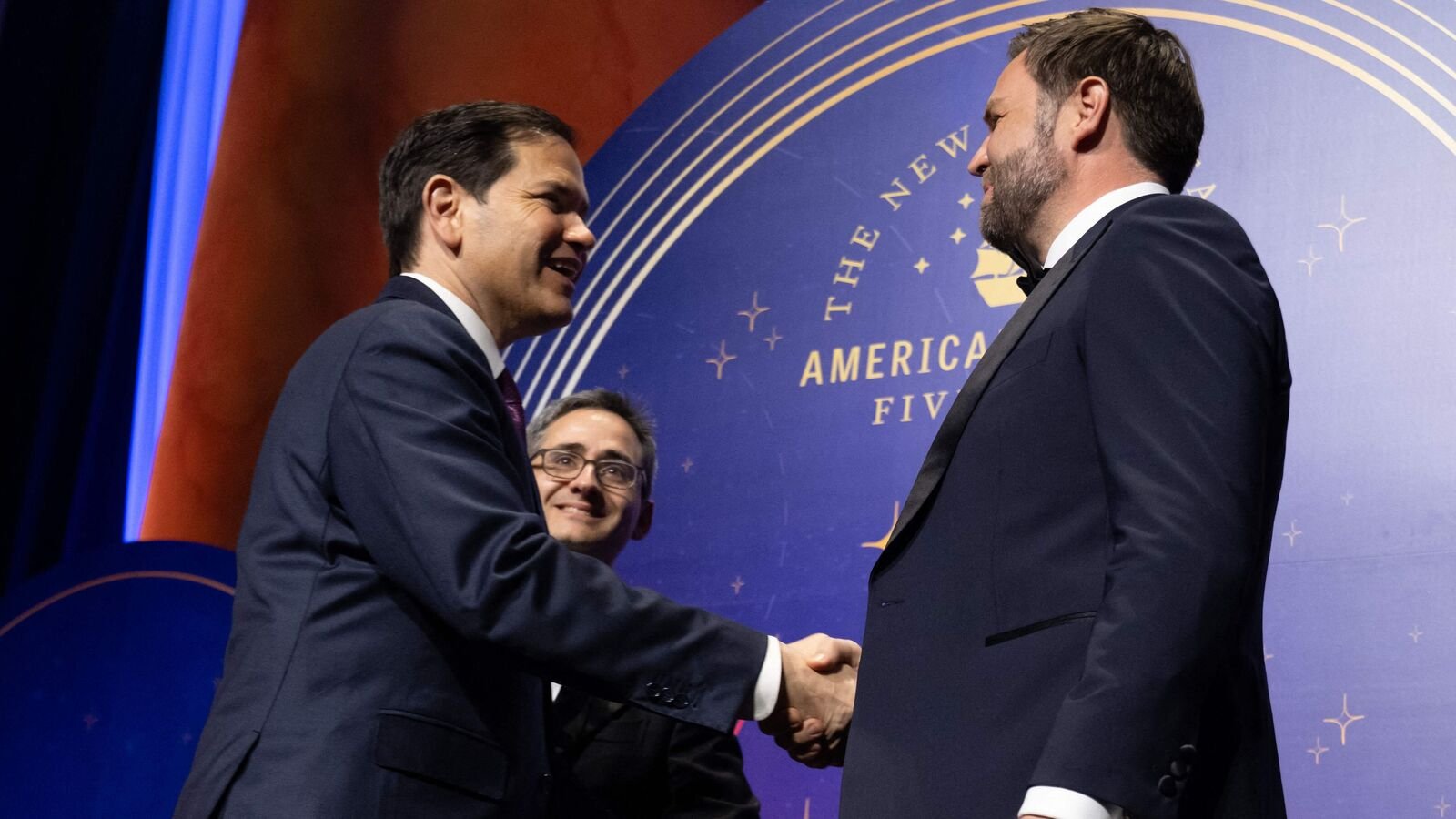 US Vice President JD Vance (R) and US Secretary of State Marco Rubio shake hands during the American Compass Fifth Anniversary Gala at the National Building Museum in Washington, DC on June 3, 2025. (Photo by SAUL LOEB / AFP)