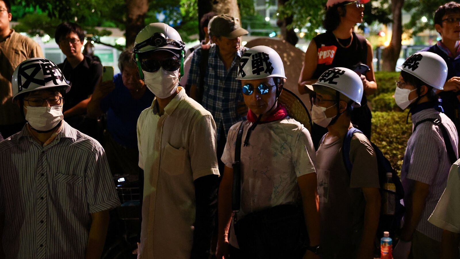 Anti-war and anti-nuclear protesters hold a rally in front of the preserved Atomic Bomb Dome, a day ahead of the 80th anniversary of the World War Two atomic bombing, in Hiroshima, western Japan,
