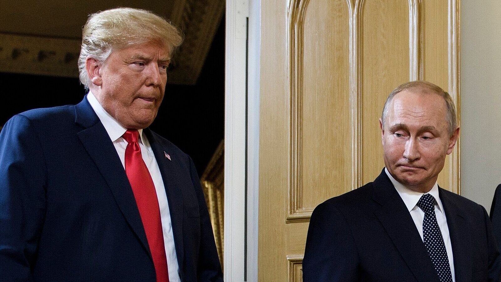 US President Donald Trump (L) and Russian President Vladimir Putin arrive for a meeting in Helsinki on July 16, 2018.