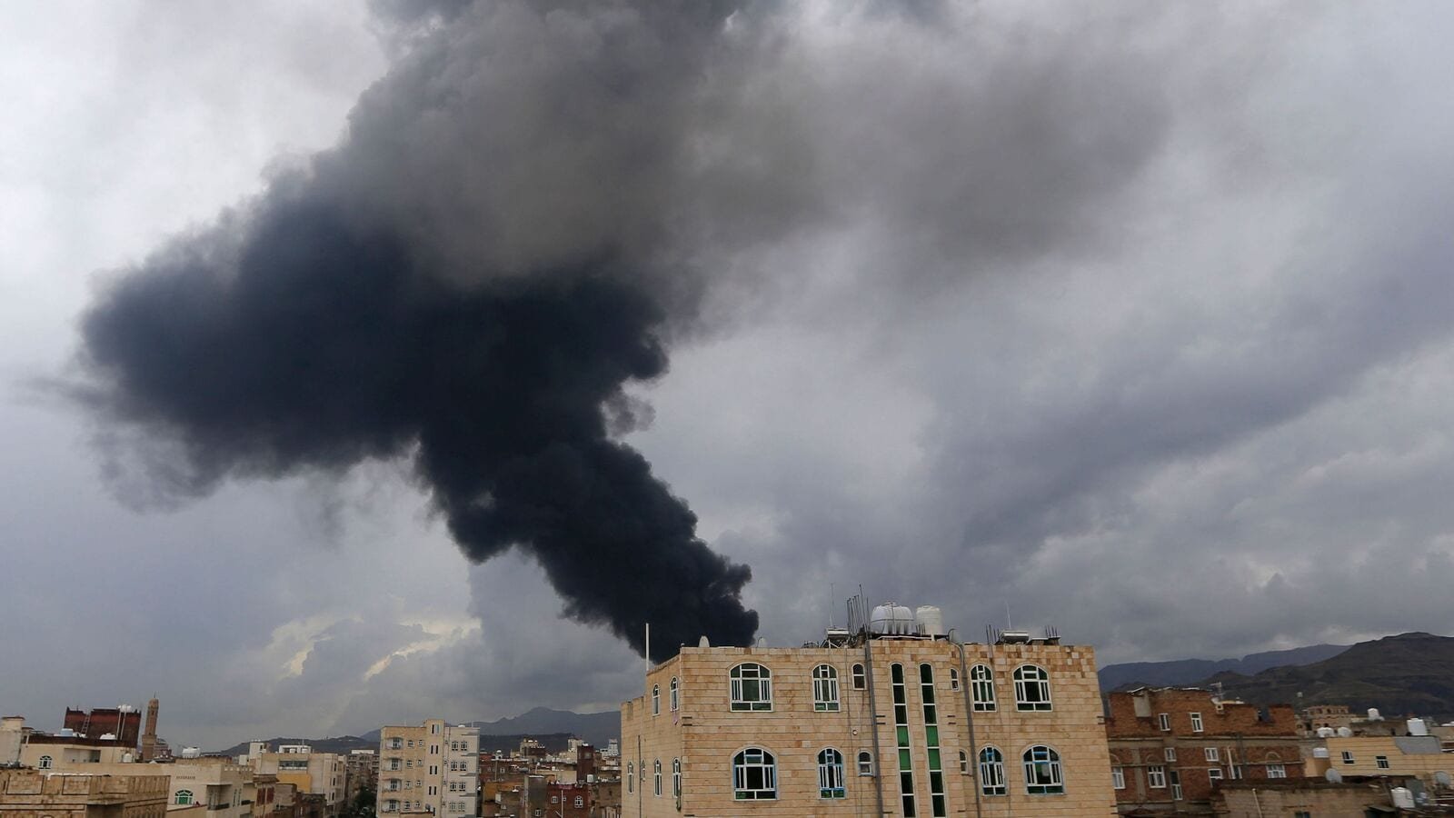 TOPSHOT - Smoke billows after an Israeli air strike on Yemen's Huthi-held capital Sanaa.