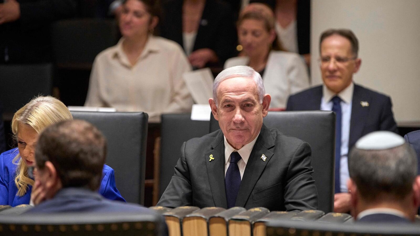 Israel's Prime Minister Benjamin Netanyahu meets with family members of the Israeli hostage Evyatar David, a hostage held captive in the Gaza Strip by Palestinian militants since the October 2023 attacks, during the opening ceremony of the Knesset Museum in Jerusalem on August 11, 2025. (Photo by Ohad Zwigenberg / POOL / AFP)