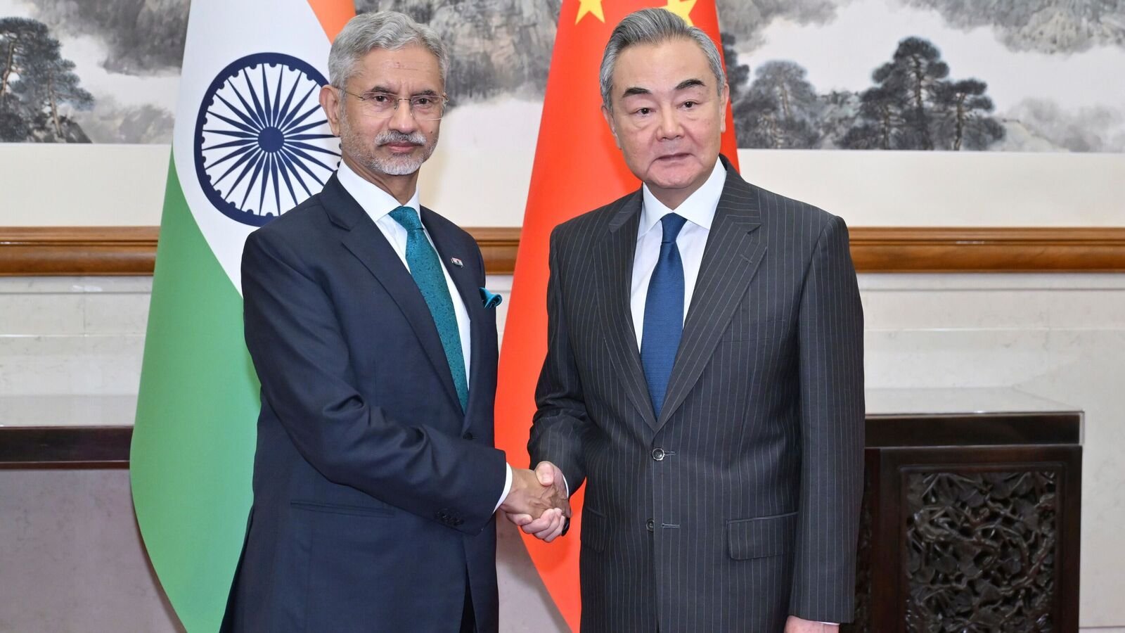Chinese Foreign Minister Wang Yi, right, shakes hands with visiting India's External Affairs Minister Subrahmanyam Jaishankar prior to their bilateral meeting, in Beijing, Monday, July 14, 2025.