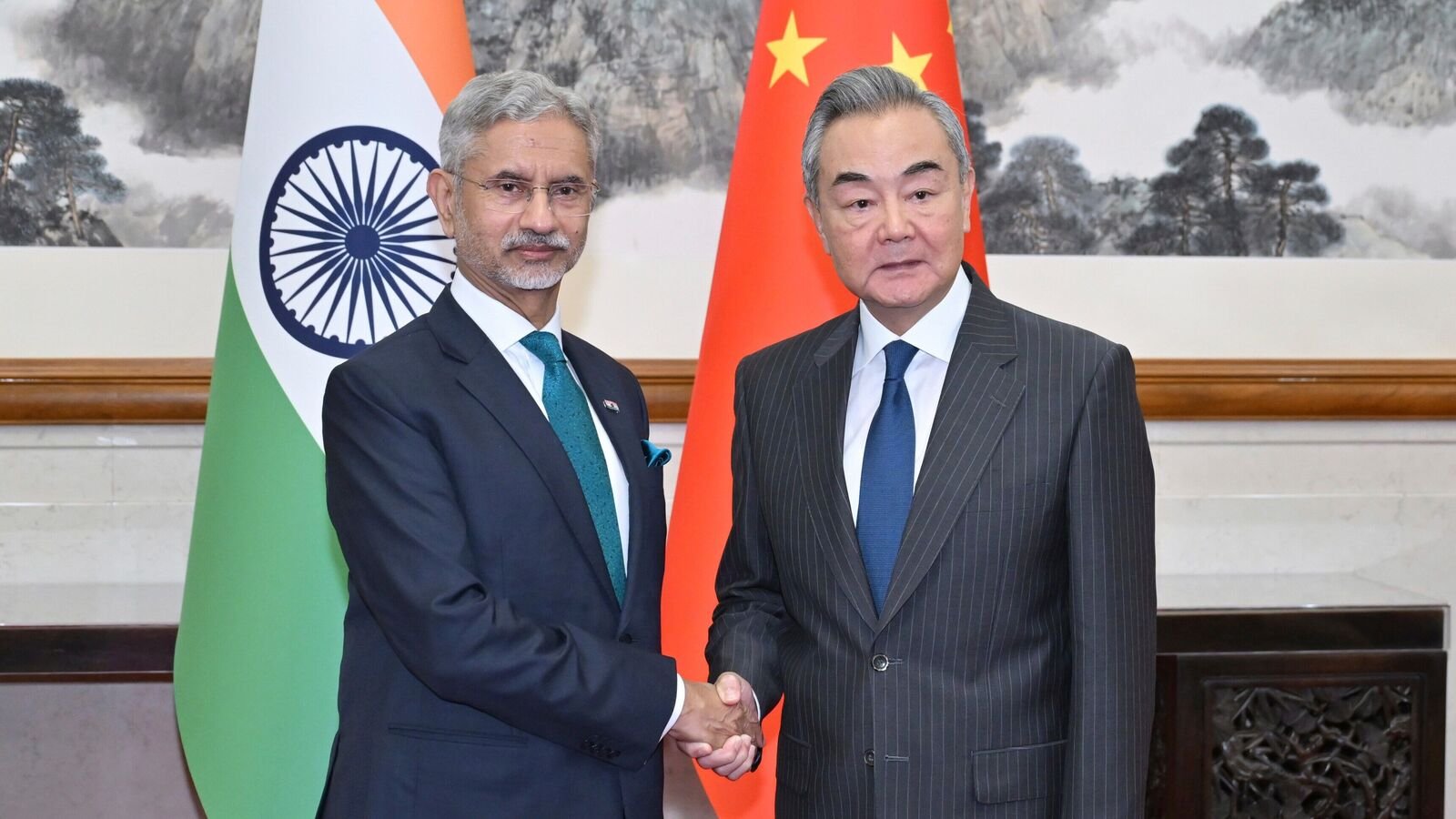 Chinese Foreign Minister Wang Yi, right, shakes hands with visiting India's External Affairs Minister Subrahmanyam Jaishankar prior to their bilateral meeting, in Beijing, Monday, July 14, 2025.