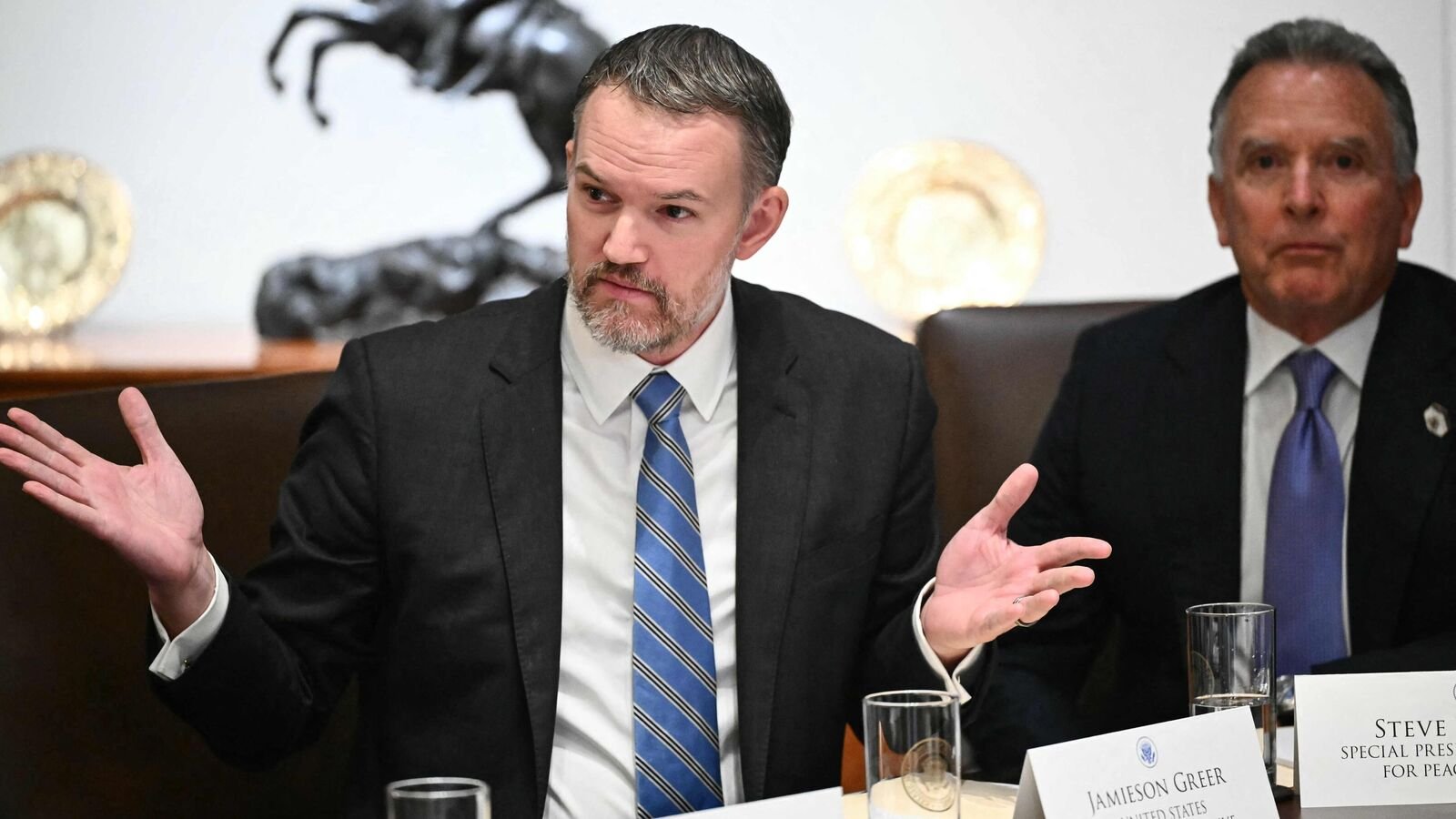 (L/R) US Trade Representative Jamieson Greer speaks as White House Special Envoy Steve Witkoff looks on during a cabinet meeting with President Donald Trump in the Cabinet Room of the White House in Washington, DC on August 26, 2025. (Photo by Mandel NGAN / AFP)