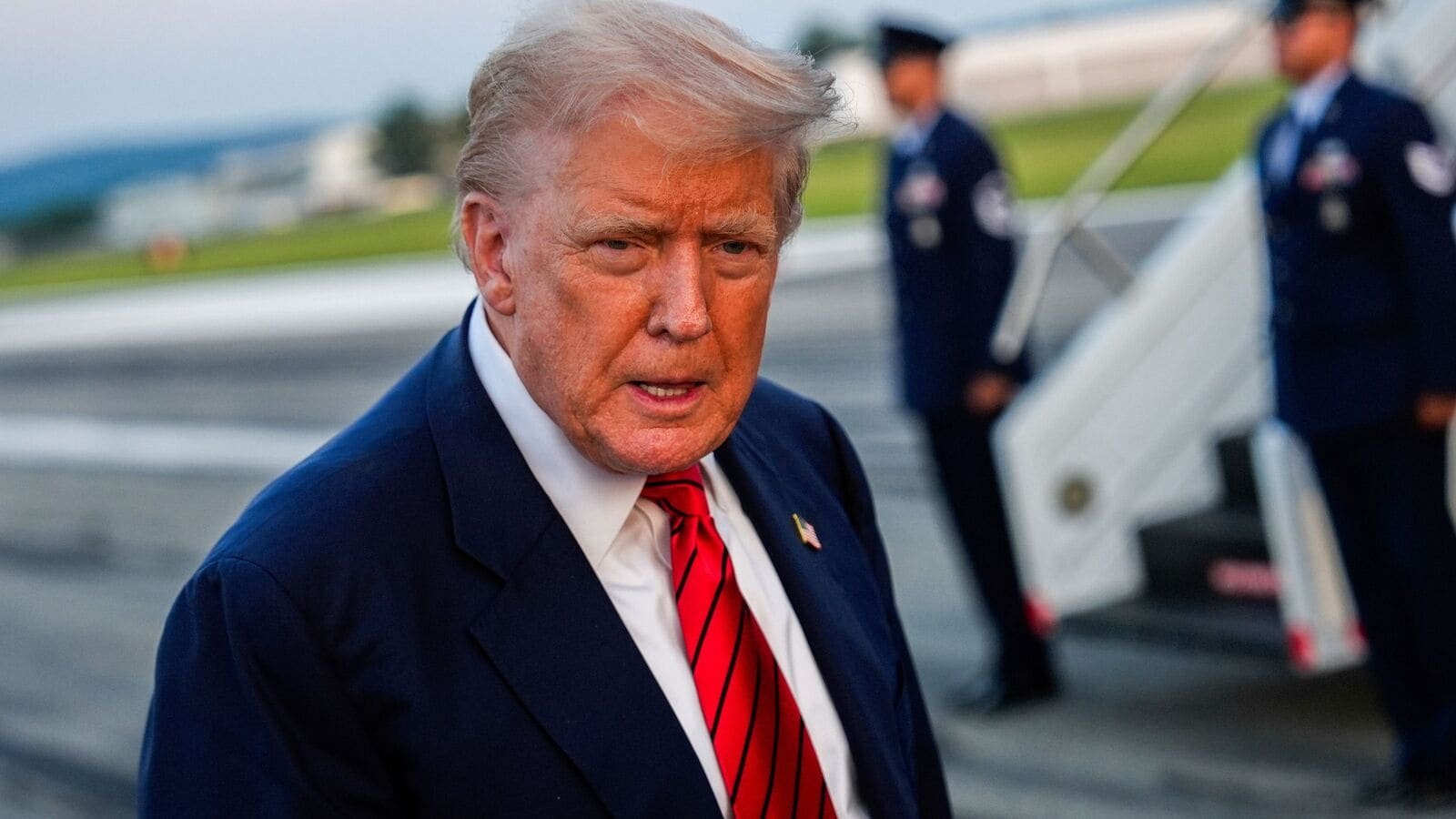 President Donald Trump speaks with reporters before boarding Air Force One at Lehigh Valley International Airport, Sunday, Aug. 3, 2025, in Allentown, Pa. (AP Photo/Julia Demaree Nikhinson)