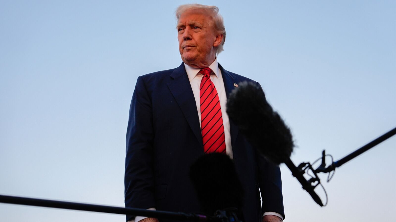 President Donald Trump speaks with reporters