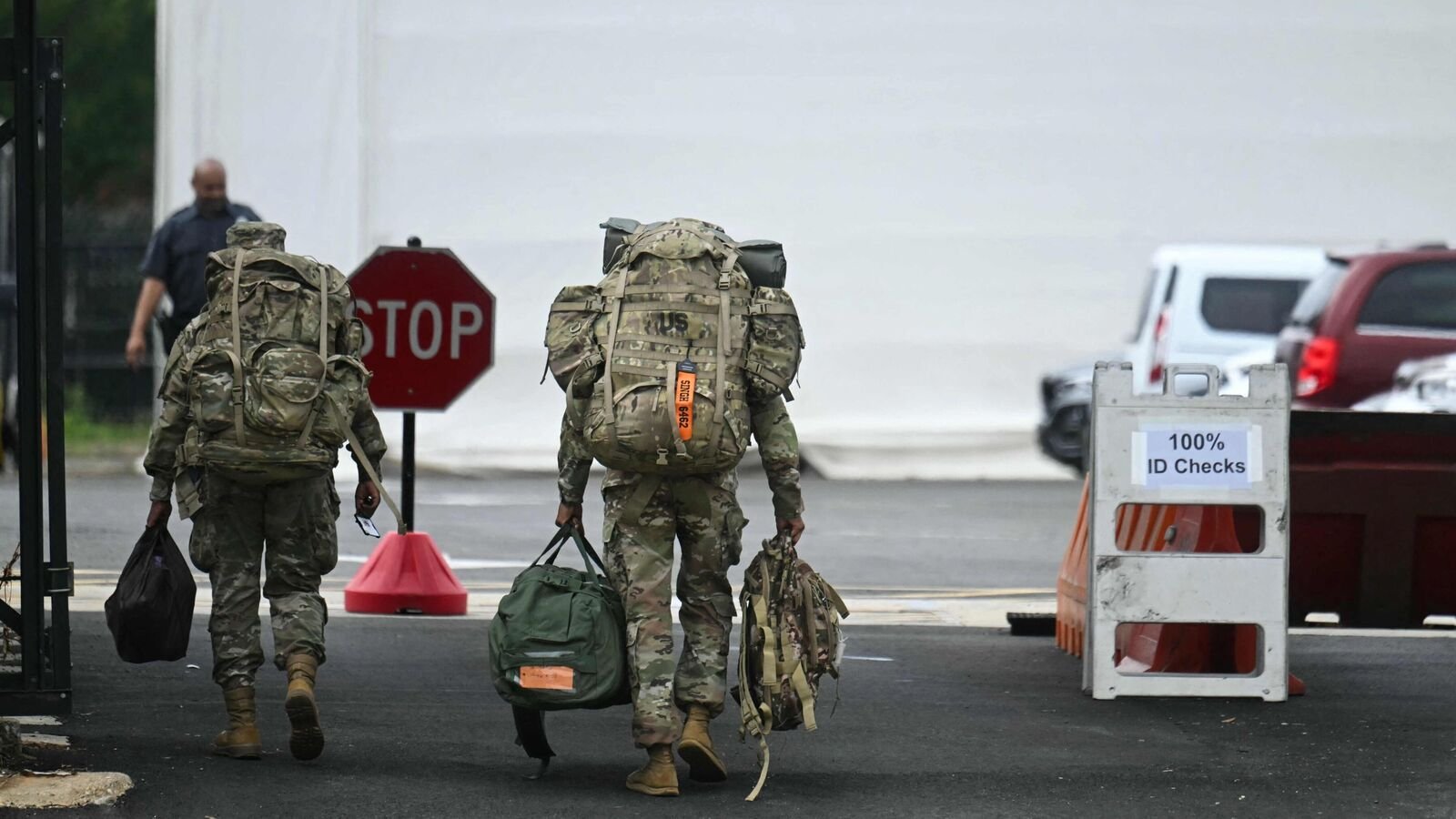 Members of the National Guard arrive at the DC Armory in Washington, DC, on August 12, 2025 where troops were given orders to report on Tuesday morning according to media reports. (Photo by Jim WATSON / AFP)