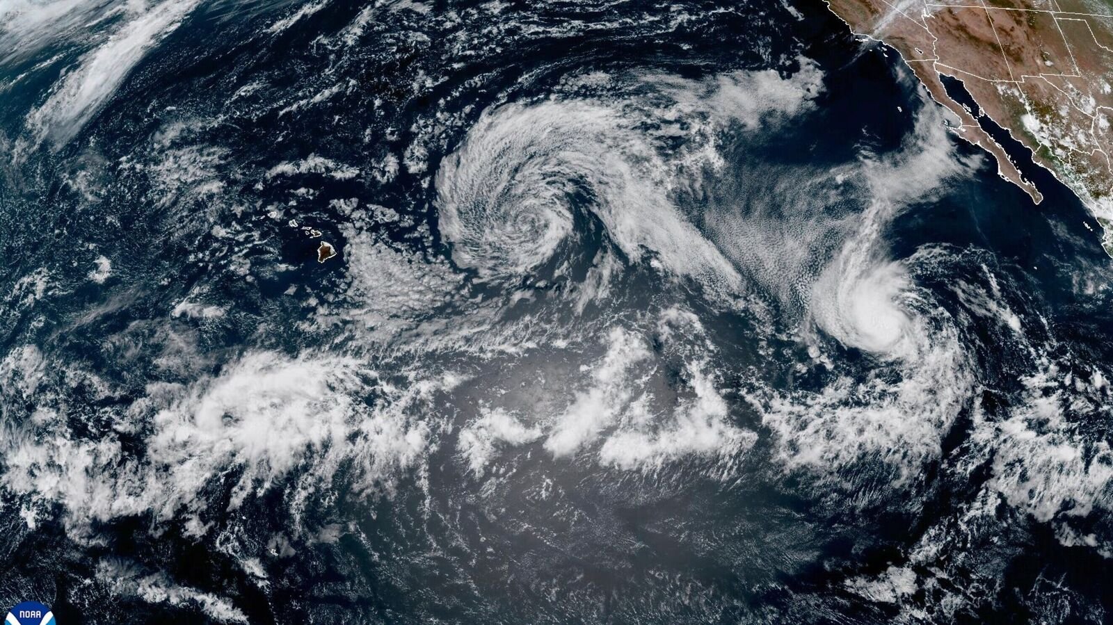 This satellite photo provided by NOAA shows Tropical Storm Henriette in the Pacific on Monday, Aug. 4, 2025. (NOAA via AP)