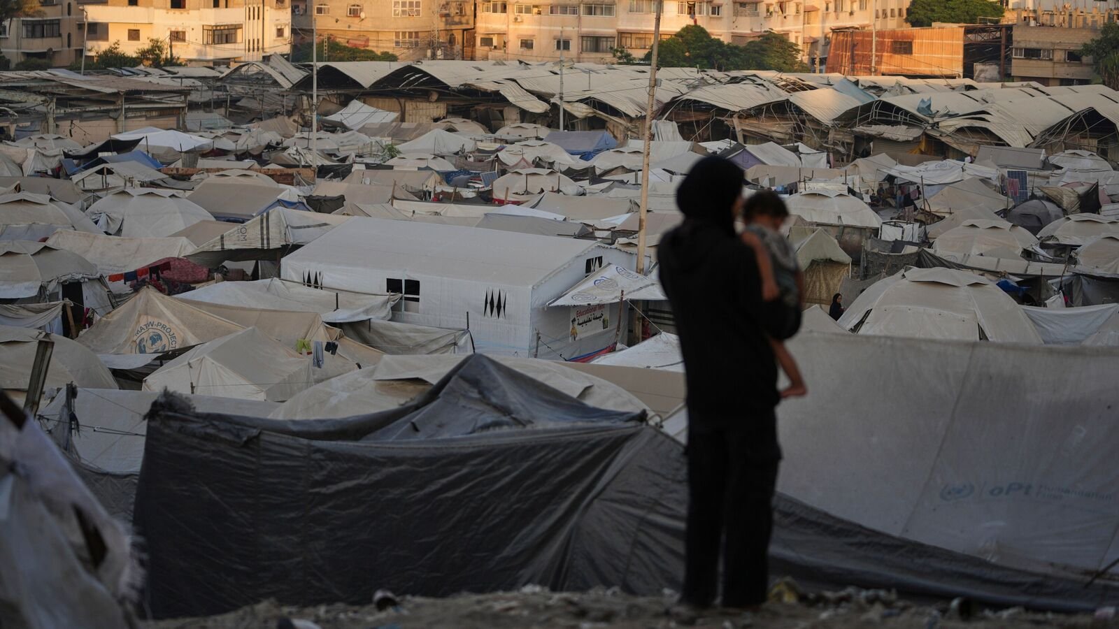 A tent camp for displaced Palestinians stretches along Gaza City, Sunday, Aug. 3, 2025.