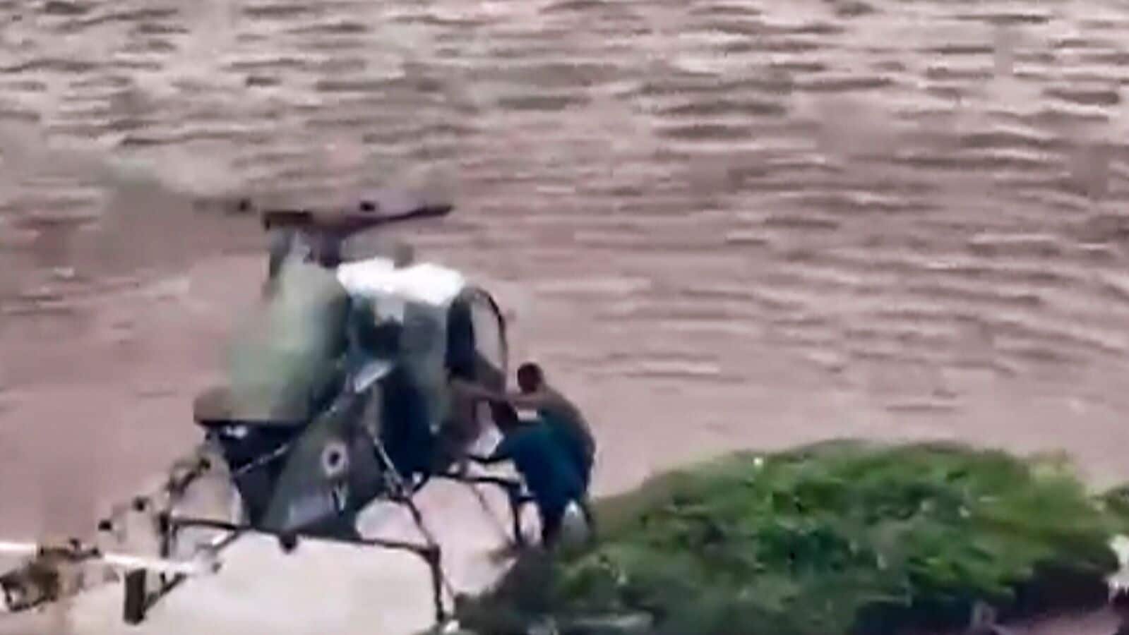 In this screengrab from a video posted on August 28, stranded people are being evacuated through an army helicopter from a flood-affected area in Gurdaspur, Punjab. (@adgpi/X via PTI Photo)