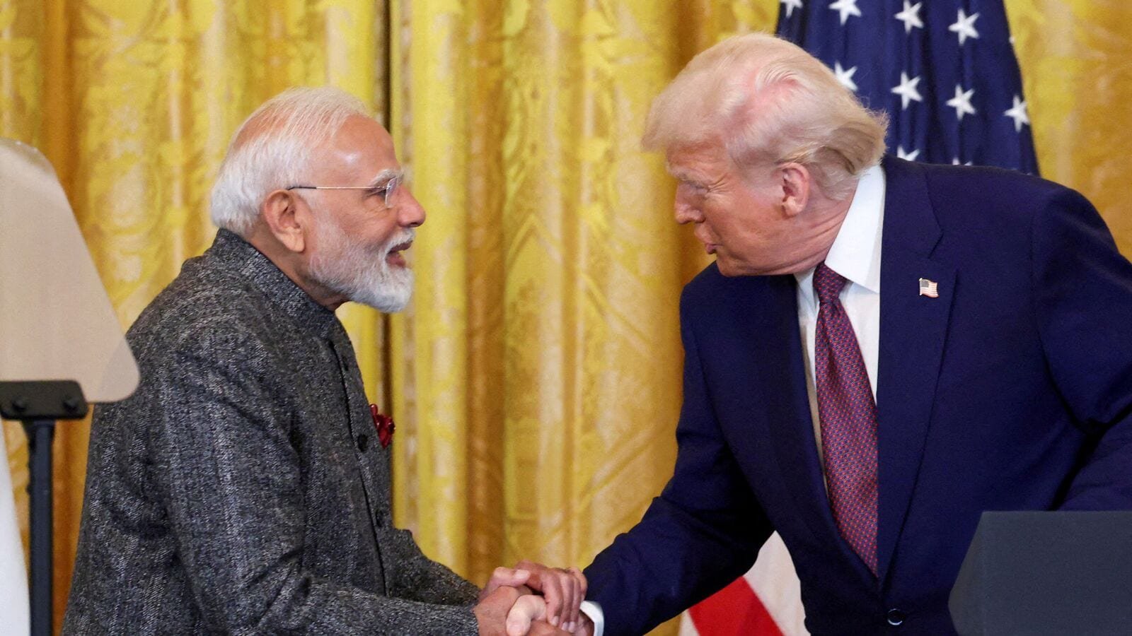 FILE PHOTO: U.S. President Donald Trump and Indian Prime Minister Narendra Modi shake hands as they attend a joint press conference at the White House in Washington, D.C., U.S., February 13, 2025. REUTERS/Kevin Lamarque/File Photo