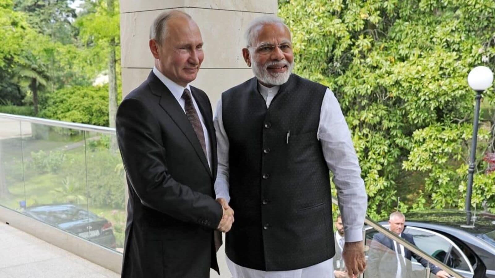 Russian President Vladimir Putin, left, and Indian Prime Minister Narendra Modi pose for a photo during their meeting in the Bocharov Ruchei residence in the Black Sea resort of Sochi, Russia.