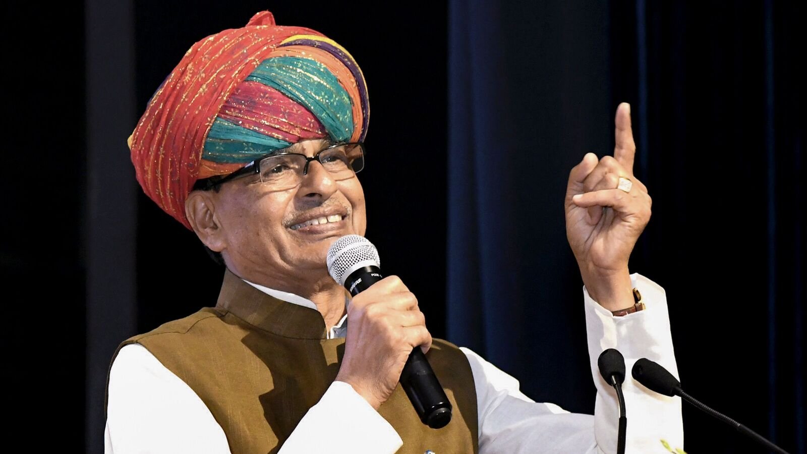 In this image via PIB, Union Minister of Agriculture and Farmers Welfare Shivraj Singh Chouhan addresses farmers from various states at a gathering, in New Delhi, Tuesday, Aug. 12, 2025. (PIB via PTI Photo)